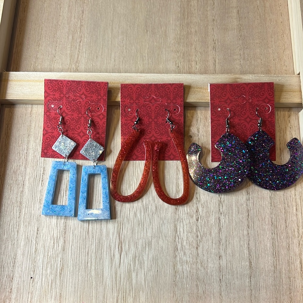 Three sets of dangle earrings